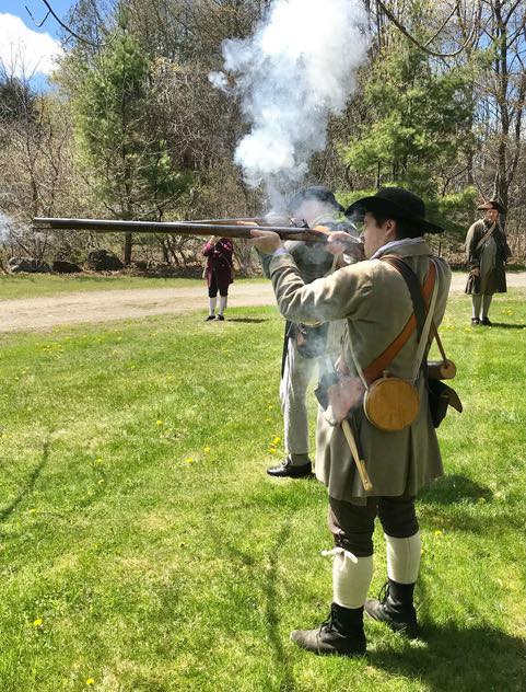 Revolutionary War soldier firing a musket